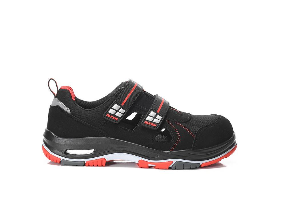 Schwarzer und roter Sportschuh mit robuster Sohle und zwei Klettverschlüssen, entwickelt für Komfort und Langlebigkeit.