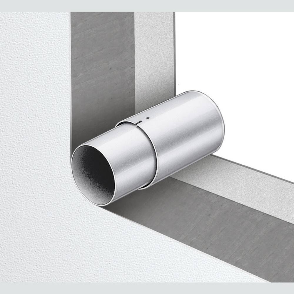 Metallischer zylindrischer Wandlüftungsverbinder, der an der Ecke montiert ist, wo zwei ebene Flächen aufeinandertreffen