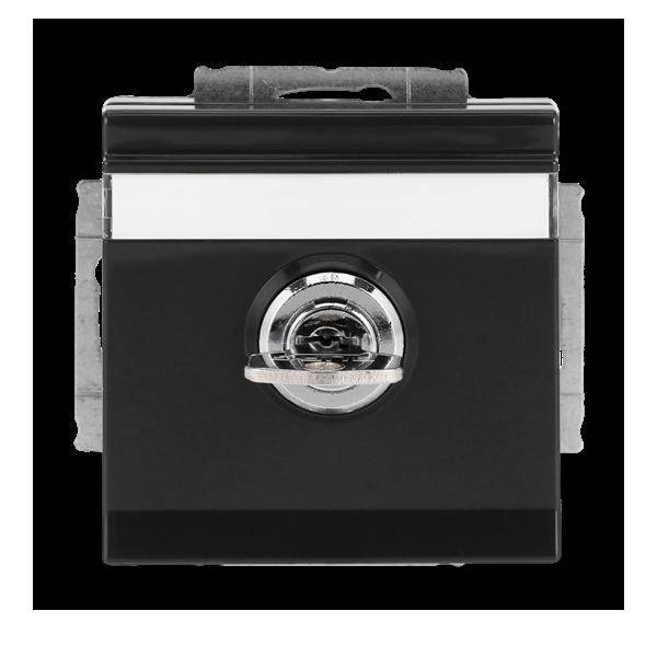 Ein schwarzer rechteckiger Elektroschalter mit einem silbernen Drehknopf in der Mitte, konzipiert zur Steuerung elektrischer Schaltkreise.