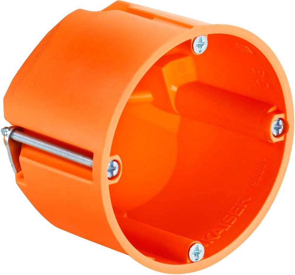 Orangefarbene zylindrische Elektrobox mit vier Schrauben an ihren Kanten.