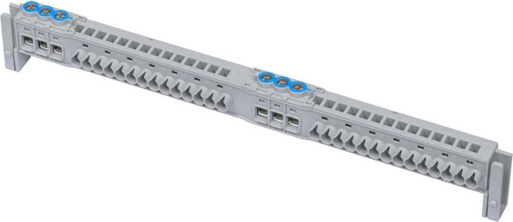 Ein grauer elektrischer Anschlussblock mit mehreren Anschlusspunkten und drei sichtbaren Schraubenklemmen auf der Oberseite.