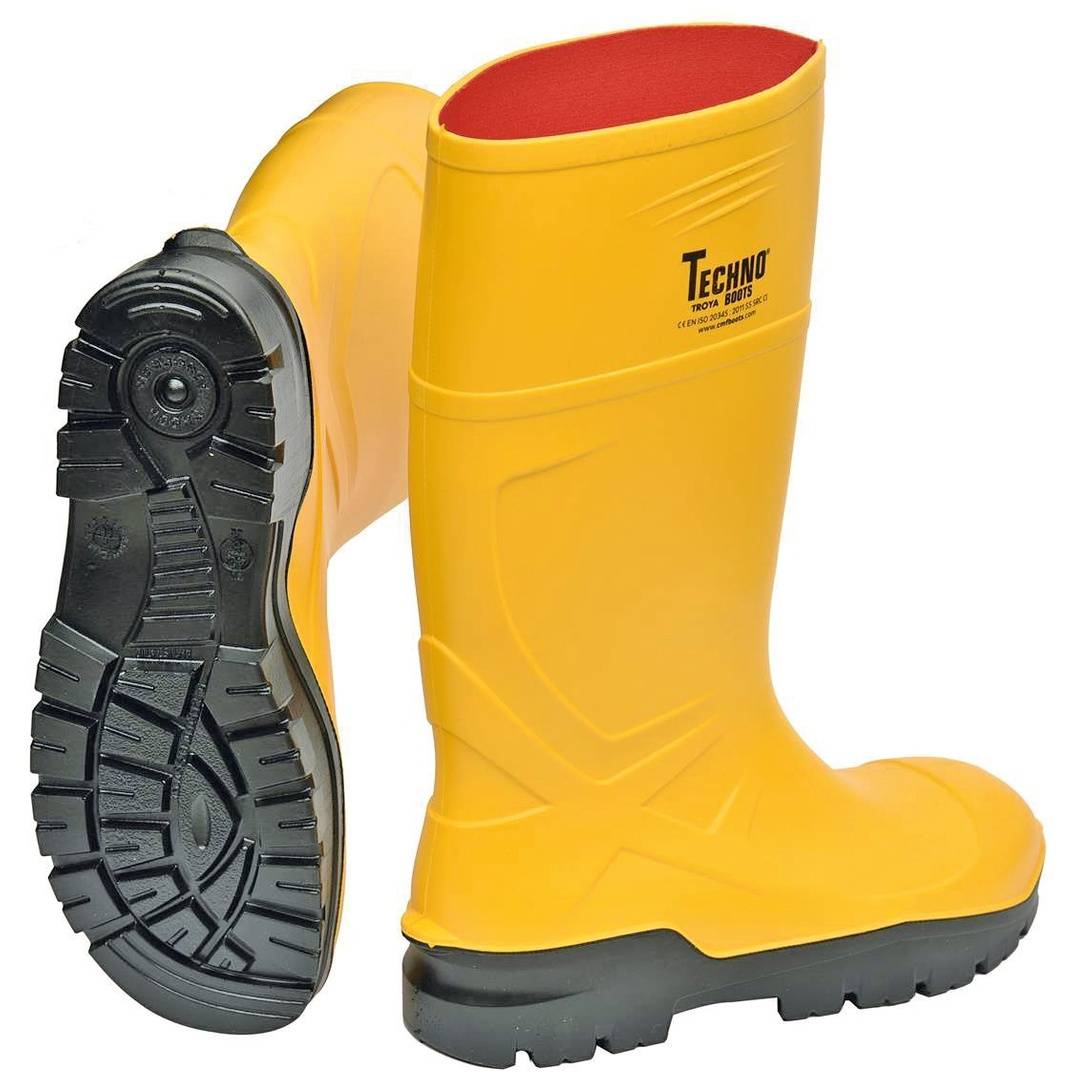 Gelbe knöchelhohe Gummiarbeitsstiefel mit schwarzen Profilsohlen, ein Stiefel zeigt die Sohle und der andere die Seite mit der Markenbezeichnung „Techno