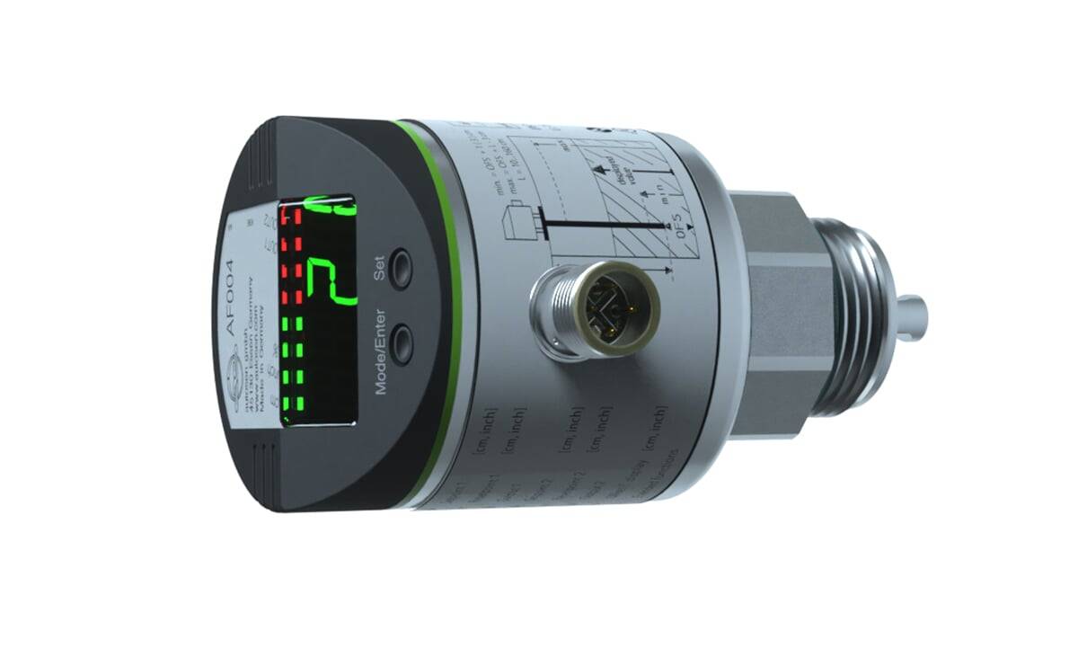 Ein zylindrischer digitaler Drucksensor mit einer LED-Anzeige, die eine Ablesung von '7' zeigt. Die Seite weist einen Anschlussport und beschriftete Einstellungen auf.