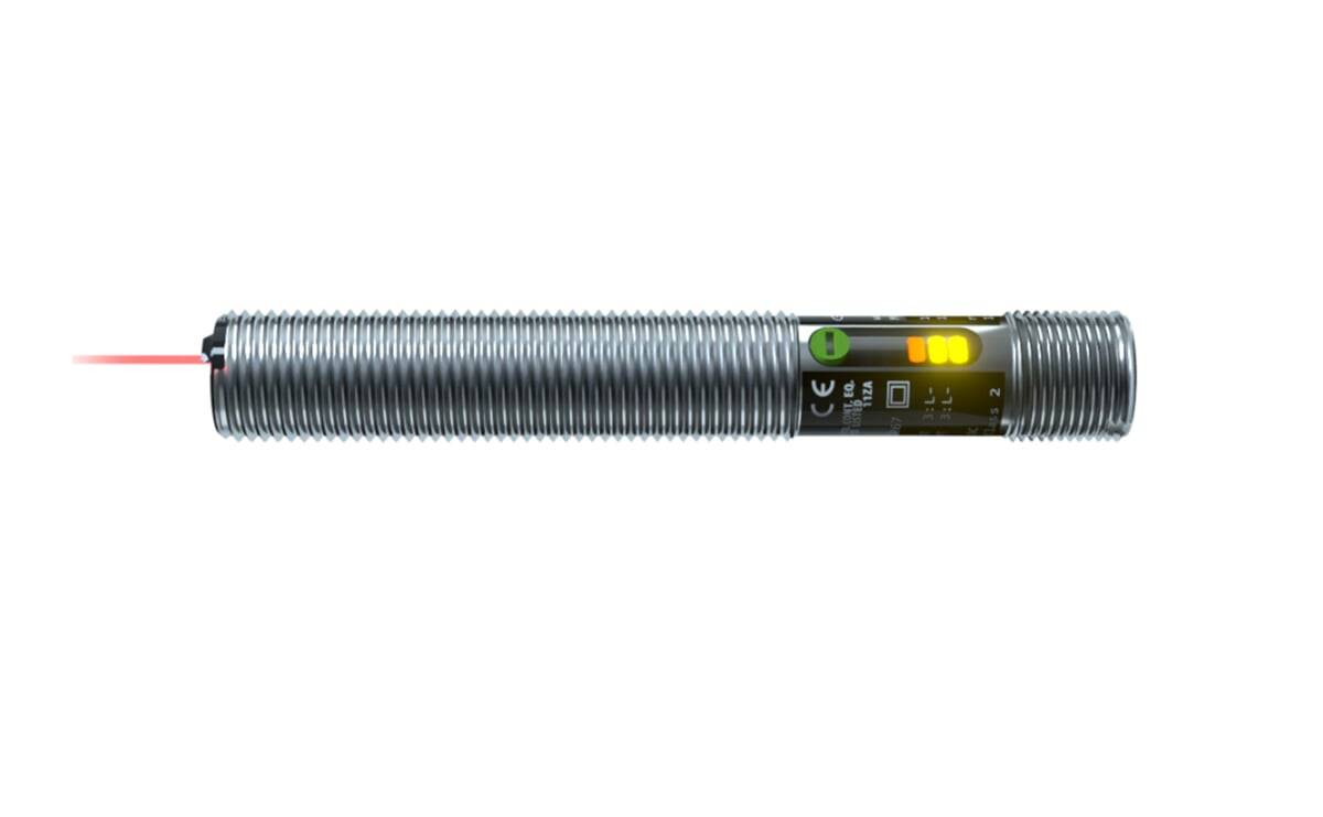 Ein röhrenförmiger Metallsensor mit gerippter Textur, ausgestattet mit einem kleinen digitalen Display und farbigen Anzeigelampen an der Seite.