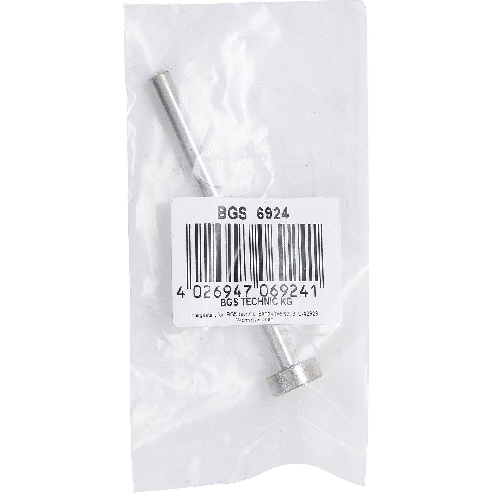 Ein kleines Metalltool in einer durchsichtigen Plastikverpackung mit einem Etikett, auf dem 