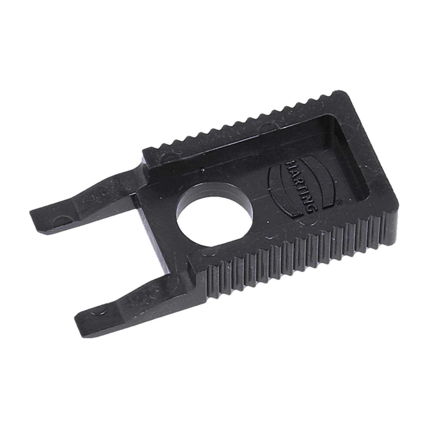 Kunststoff-Werkzeug mit zwei Zinken und einem zentralen Loch, ausgestattet mit strukturierten Kanten und dem Aufdruck 'Haring'. Wird für Anpassungen von elektrischen Komponenten verwendet.