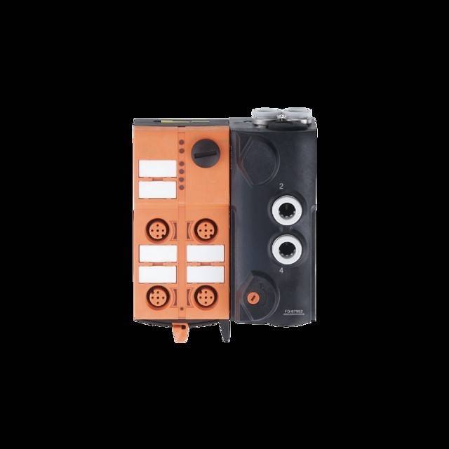 Ein kompaktes, rechteckiges elektronisches Gerät mit orange und schwarzen Elementen, das verschiedene Anschlüsse und beschriftete Ports auf seiner Oberfläche aufweist.