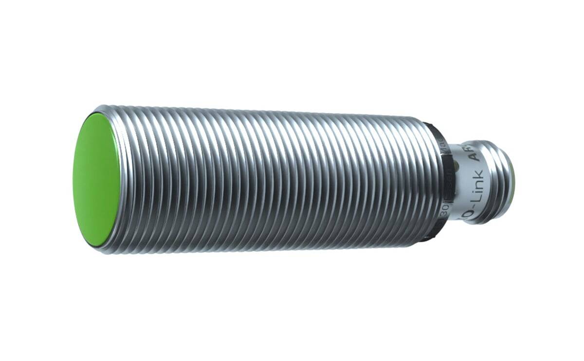 Eine Nahaufnahme eines gewindelförmigen zylindrischen Objekts, höchstwahrscheinlich ein Sensor oder eine industrielle Komponente, mit einem Metallgehäuse und einem grün umrandeten Enddeckel.