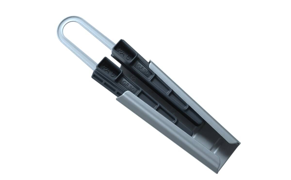 Zwei schwarze hydraulische Push-to-Open-Anschlüsse in einem silbernen Halter, mit den Zahlen '69(10)', die auf den Anschlüssen sichtbar sind.