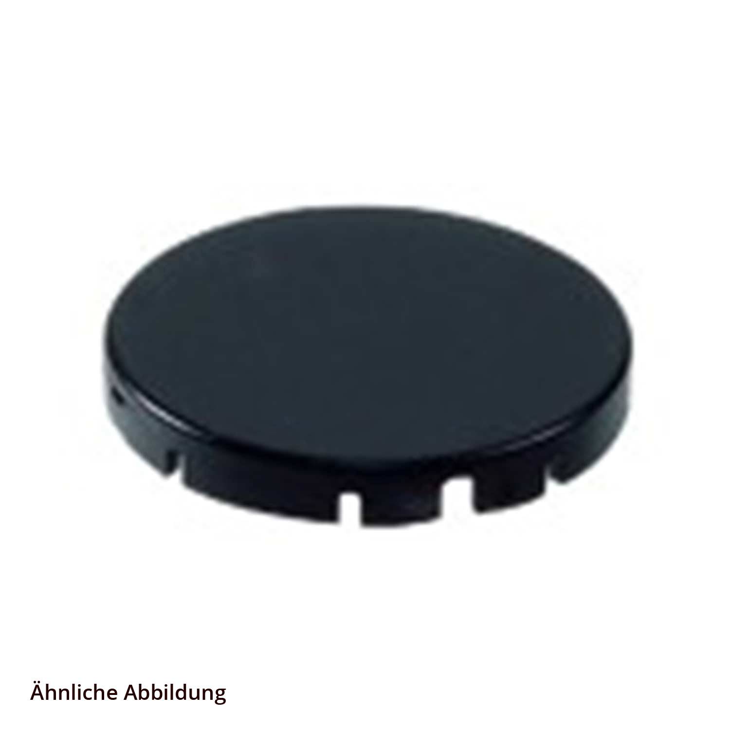 Ein schwarzer, runder Plastikdeckel mit Schlitzen, der vor einem weißen Hintergrund dargestellt wird.