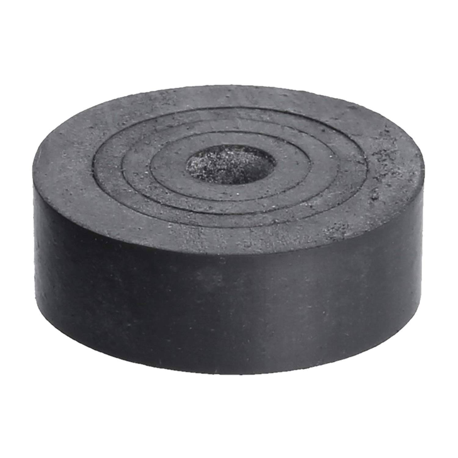Ein runder, flacher, schwarzer Gummipuffer mit einer zentralen Vertiefung, der zur Stoßdämpfung in verschiedenen mechanischen Anwendungen verwendet wird.