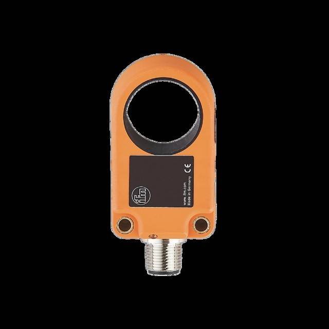 Ein orangefarbenes elektronisches Gerät mit einer kreisförmigen Öffnung und einem Anschluss, das Herstellerinformationen und CE-Konformitätskennzeichnung zeigt.