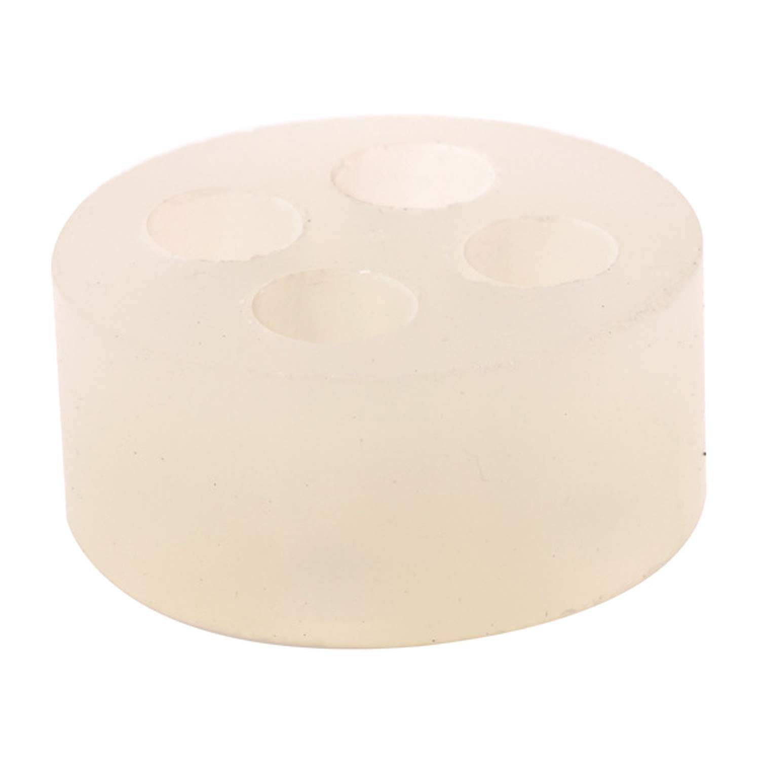 Ein rundes, durchsichtiges Silikonobject mit vier zylindrischen Löchern oben, entworfen als Röhrenhalter oder Organizer.
