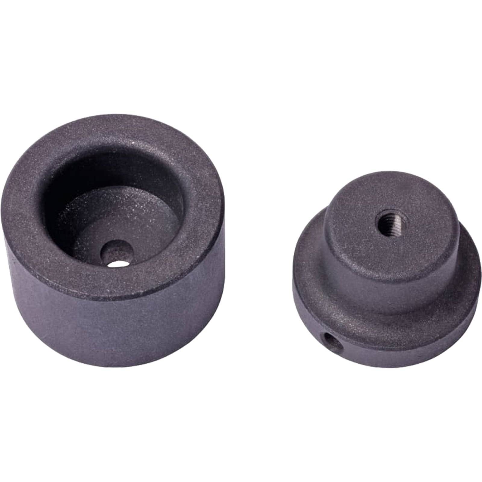 Zwei schwarze Metallkomponenten mit einem hohlen zylindrischen Teil und einer abgerundeten Kappe, jeweils mit einem zentralen Loch, für mechanische Montage verwendet.