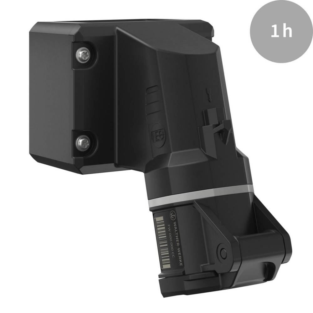 Schwarzes, eckiges Gerät mit Montagebefestigung, möglicherweise ein Sensor oder eine Kamera. Oben rechts befindet sich die Beschriftung '1h', die auf Zeit oder Dauer hinweist.