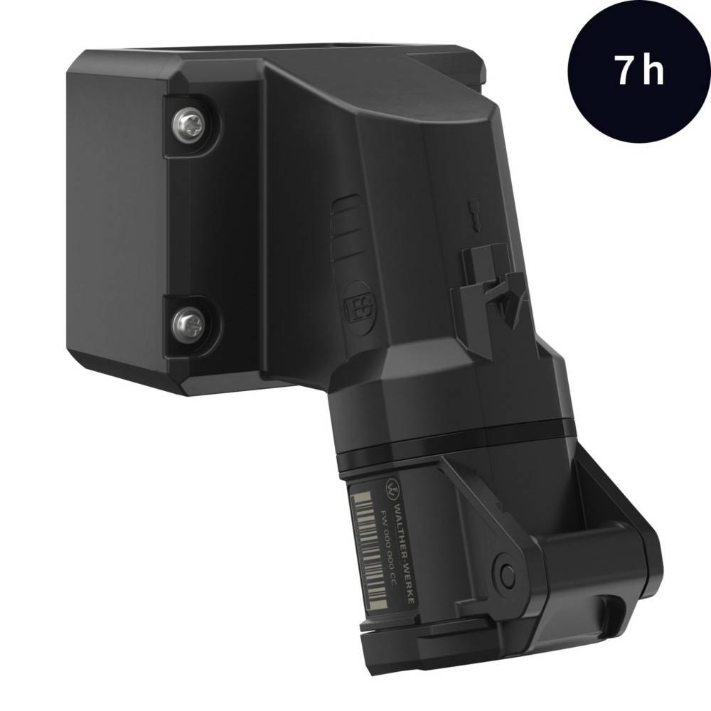 Ein schwarzes, eckiges elektronisches Gerät mit zwei sichtbaren Schrauben an der Seite. Ein dunkler Kreis mit der weißen Schrift '7h' ist in der Ecke zu sehen.