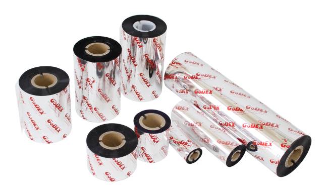 Mehrere Rollen aus Weißetikettenmaterial oder Thermopapier mit schwarzen Kernen, in verschiedenen Größen auf weißem Hintergrund gezeigt.