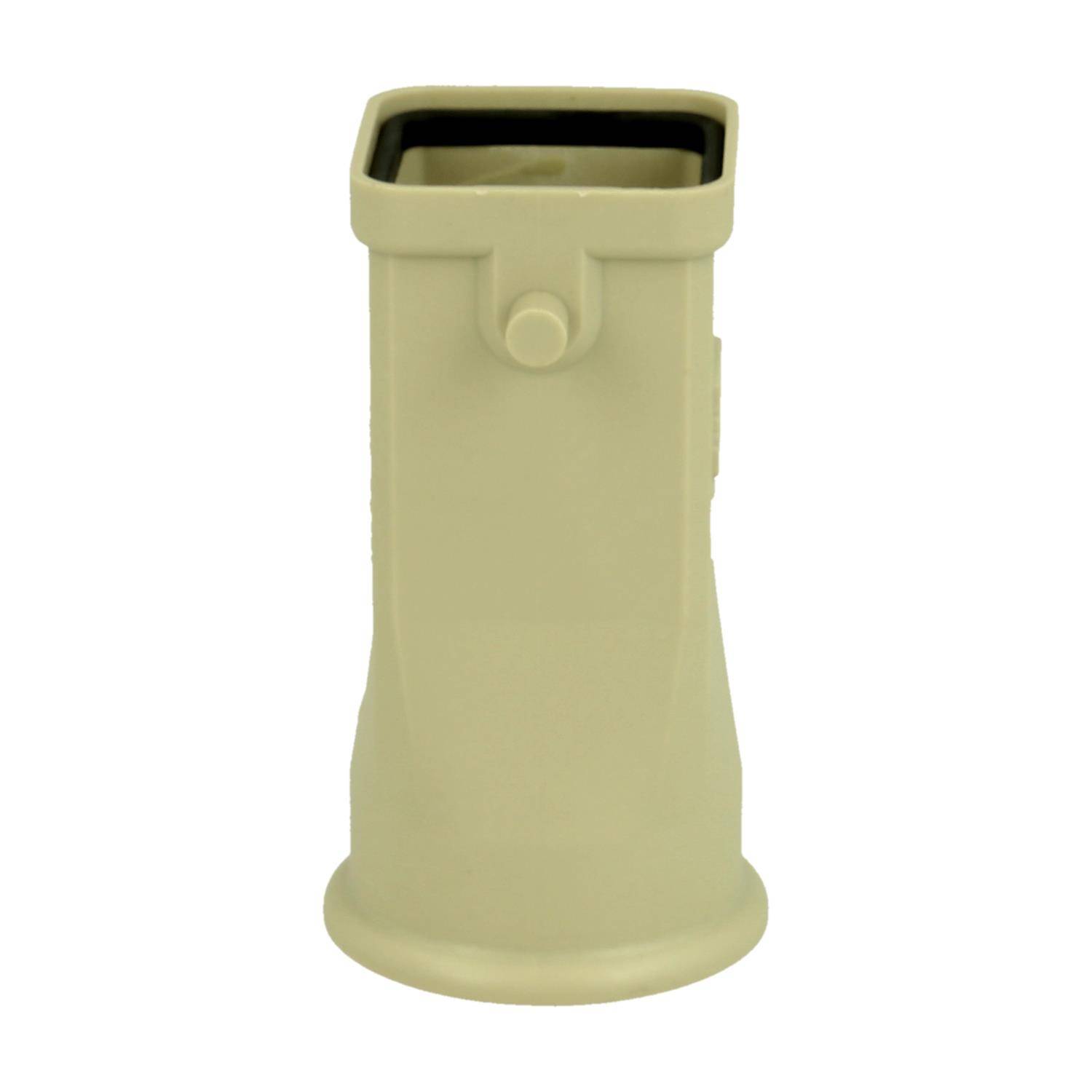 Ein beige-farbener, zylindrischer Plastikgegenstand mit quadratischer Oberseite und einem hervorstehenden Knopf, möglicherweise Teil einer Vorrichtung oder Maschine.