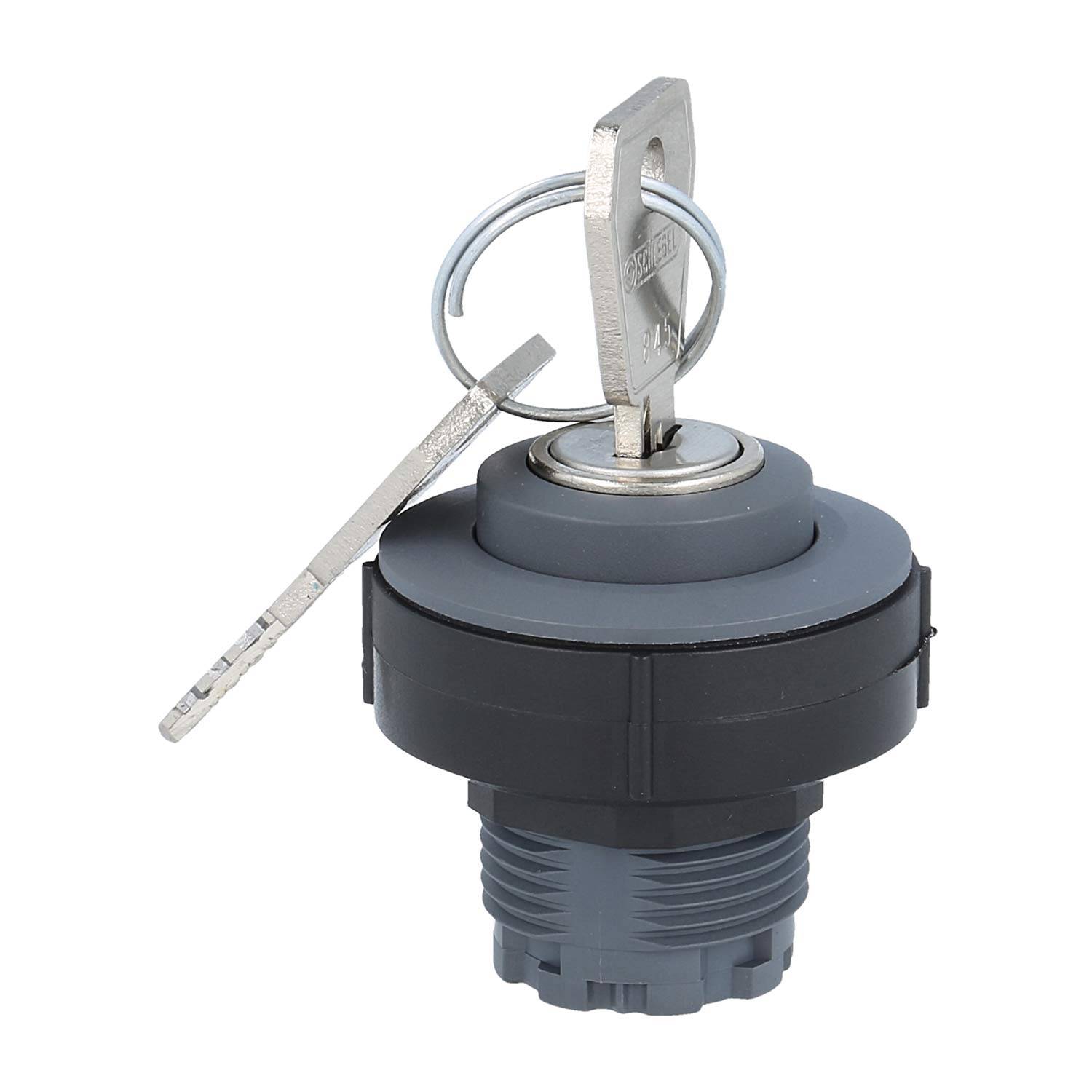 Ein Nahaufnahme eines grauen Schließzylinders mit einem eingelegten Schlüssel und einem angehängten Ring, der zum Sichern von Maschinen oder Ausrüstung verwendet wird.