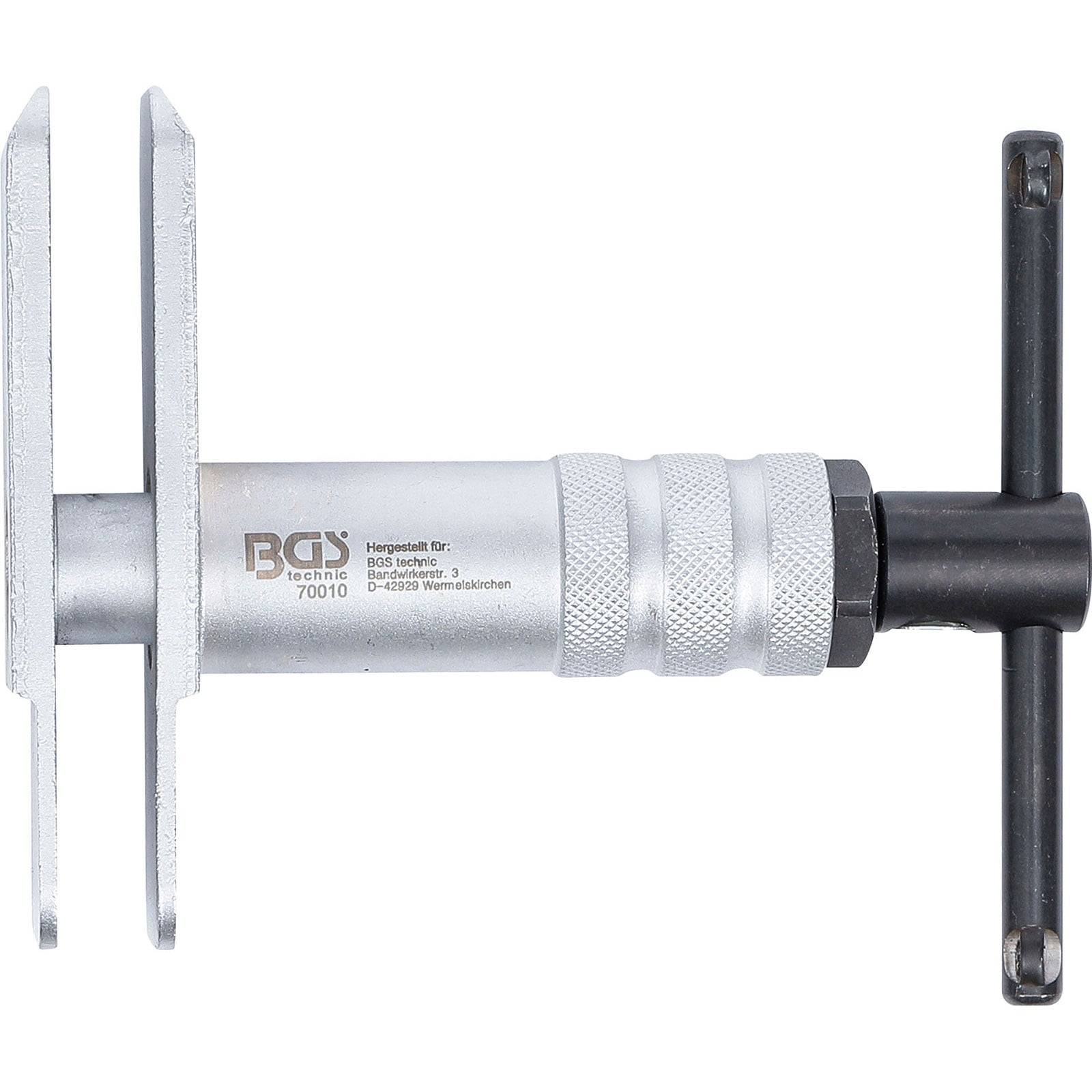 Ein weißer und silberner Abzieher mit einem T-förmigen Griff zum Trennen von Komponenten bei mechanischen Arbeiten.