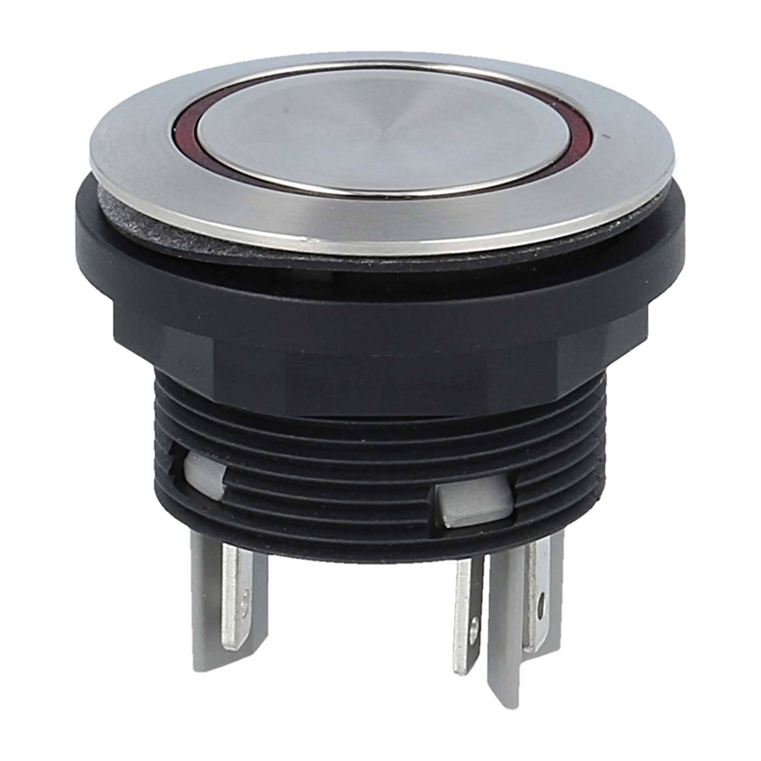 Ein runder, metallischer Drucktaster mit einem schwarzen Gehäuse und drei Metallanschlüssen für elektrische Verbindungen.