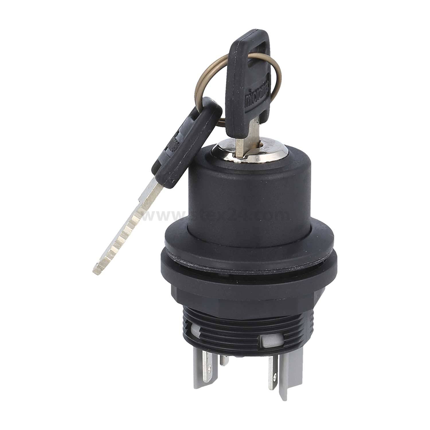 Schwarzer Zündschalter mit zwei eingesteckten Schlüsseln, die oben aufliegen. Der Schalter hat drei Metallstifte an der Basis für elektrische Anschlüsse.