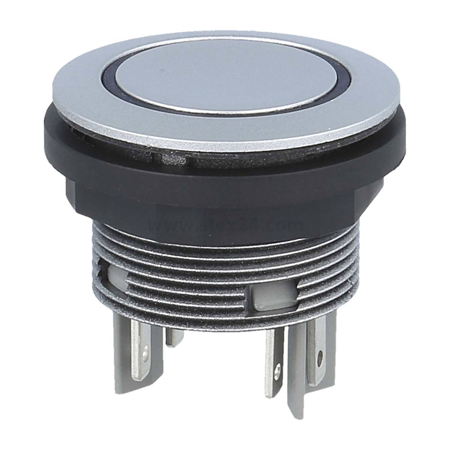 Ein metallischer Drucktastenschalter mit kreisförmigem Design und vier Anschlüssen, der in elektronischen Geräten oder Maschinen für Steuerungsfunktionen verwendet wird.