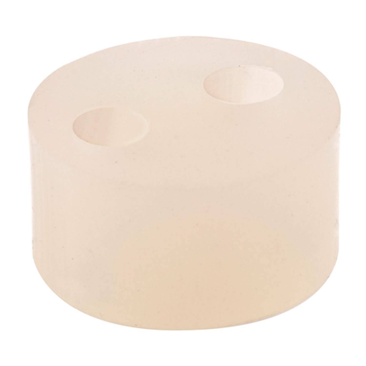 Ein beiger Gummistopfen mit zwei Löchern unterschiedlicher Größe.