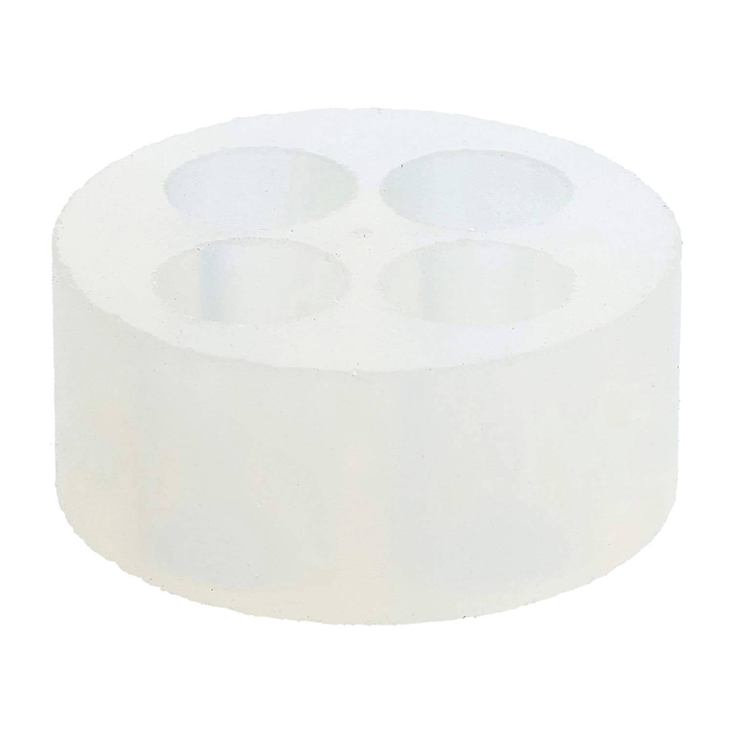 Ein weißes, rundes Silikonform mit vier zylindrischen Hohlräumen, verwendet zum Herstellen von Produkten wie Seifen oder Kerzen.