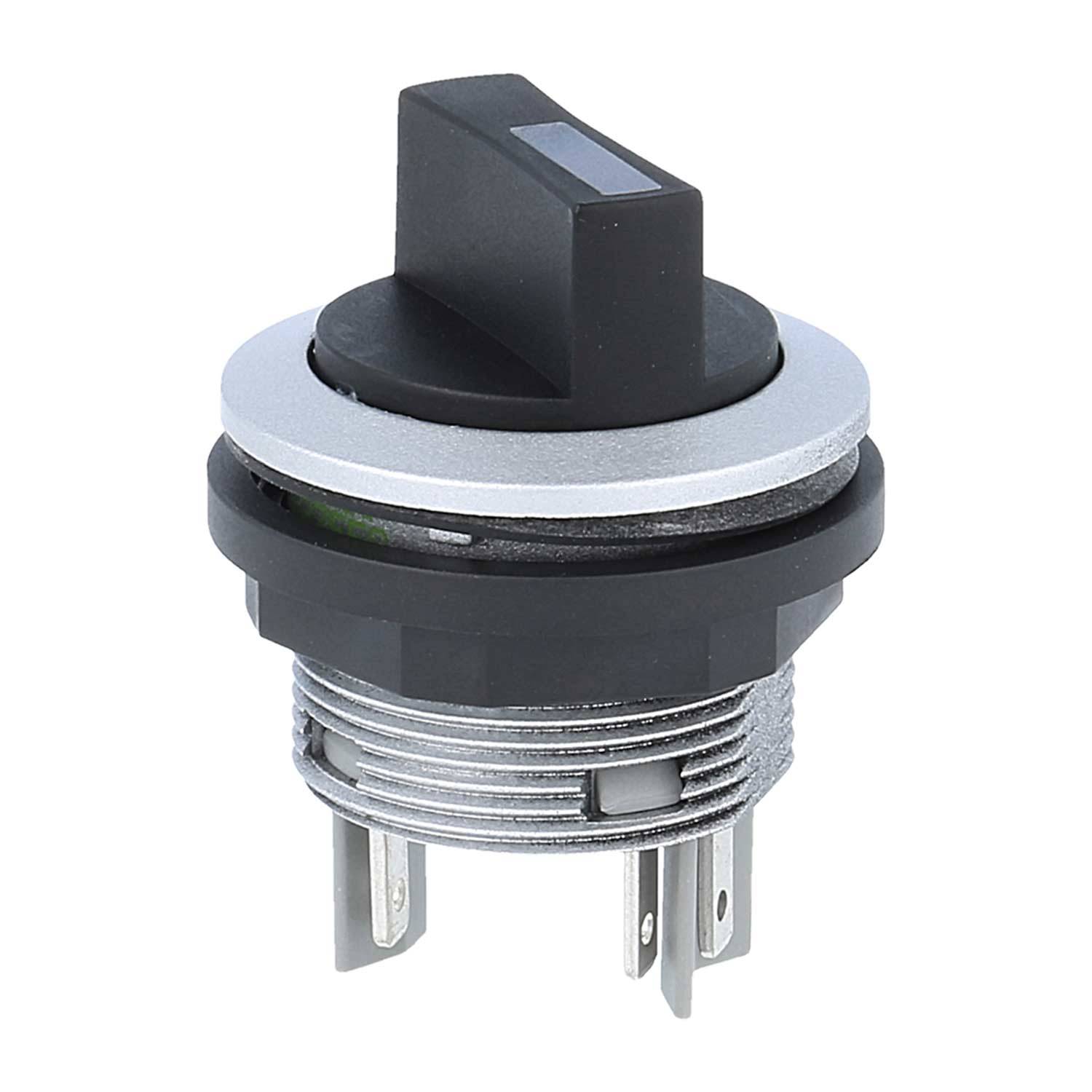 Ein runder schwarzer Kippschalter mit Metallkontakten, der in einer silbernen Rundblende eingesetzt ist und aufrecht positioniert ist.