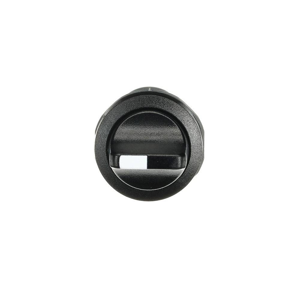 Kreisrunde schwarze Komponente mit horizontalem und vertikalem Schlitz in der Mitte, die einer Linse oder einem komplexen mechanischen Bauteil ähnelt.