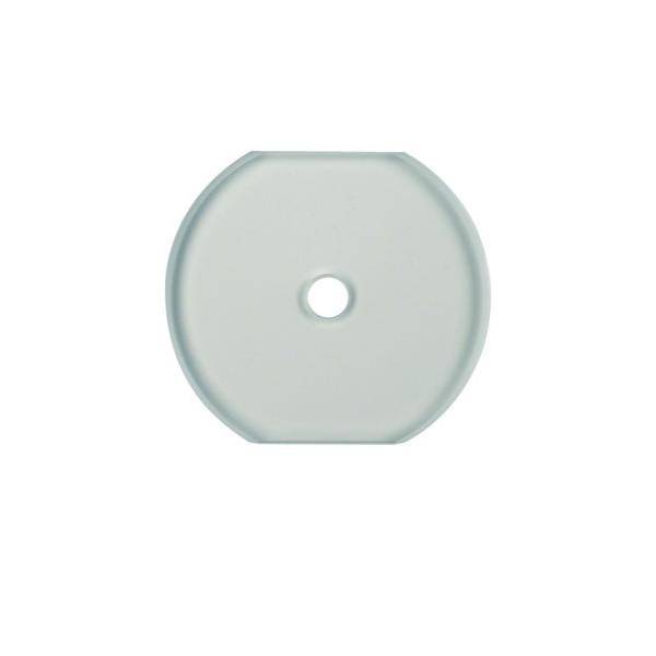 Eine durchscheinende, runde Scheibe mit einem zentralen Loch, die einer Unterlegscheibe oder einem Abstandshalter ähnelt, isoliert vor einem weißen Hintergrund.