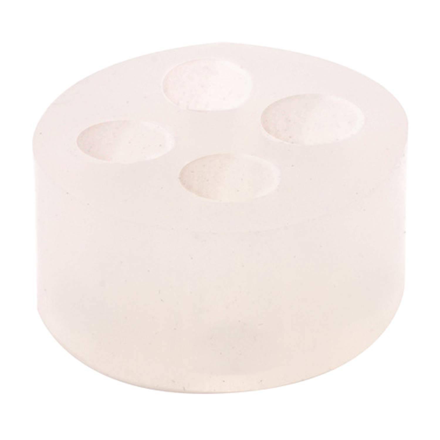 Ein weißer, runder Silikonwürfel mit vier tiefen kreisförmigen Vertiefungen oben, typischerweise zum Herstellen von Seife oder Kerzen verwendet.