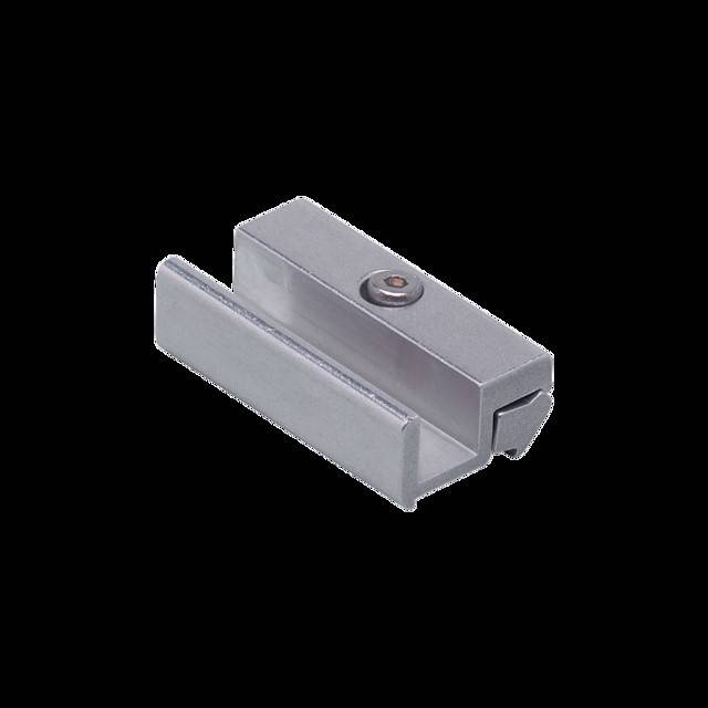 Ein metallischer Linearschlitten, der für präzise lineare Bewegungssysteme verwendet wird, vor einem einfarbigen schwarzen Hintergrund.