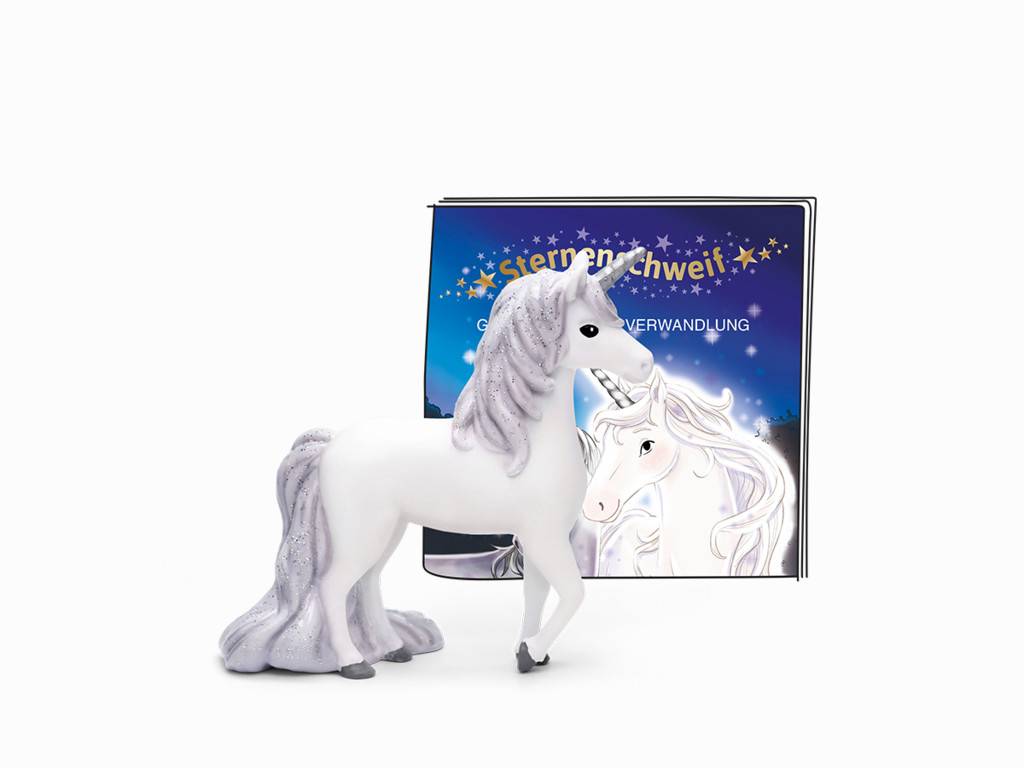 Weiße Einhorn-Figur, die neben einem Buch mit dem Titel „Sternenpferd