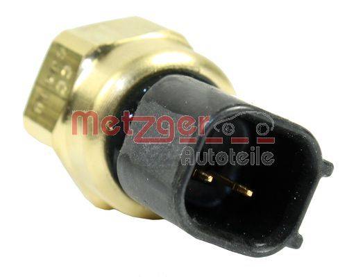 Eine Nahaufnahme eines metallischen Automotive-Sensors mit einem schwarzen Kunststoffstecker. Der Markenname 'Metzger Autoteile' ist darauf gedruckt.