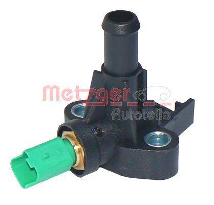 Ein schwarzer Kunststoff-Autosensor mit grünem Stecker und Metallbefestigungslöchern, der zur Überwachung verschiedener Fahrzeugfunktionen verwendet wird.