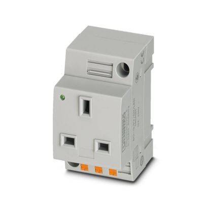 Ein kleines, graues Kunststoff-Elektrogerät mit mehreren Anschlußpunkten, möglicherweise eine modulare Klemmleiste oder ein Relais, das in der Schaltungstechnik verwendet wird.