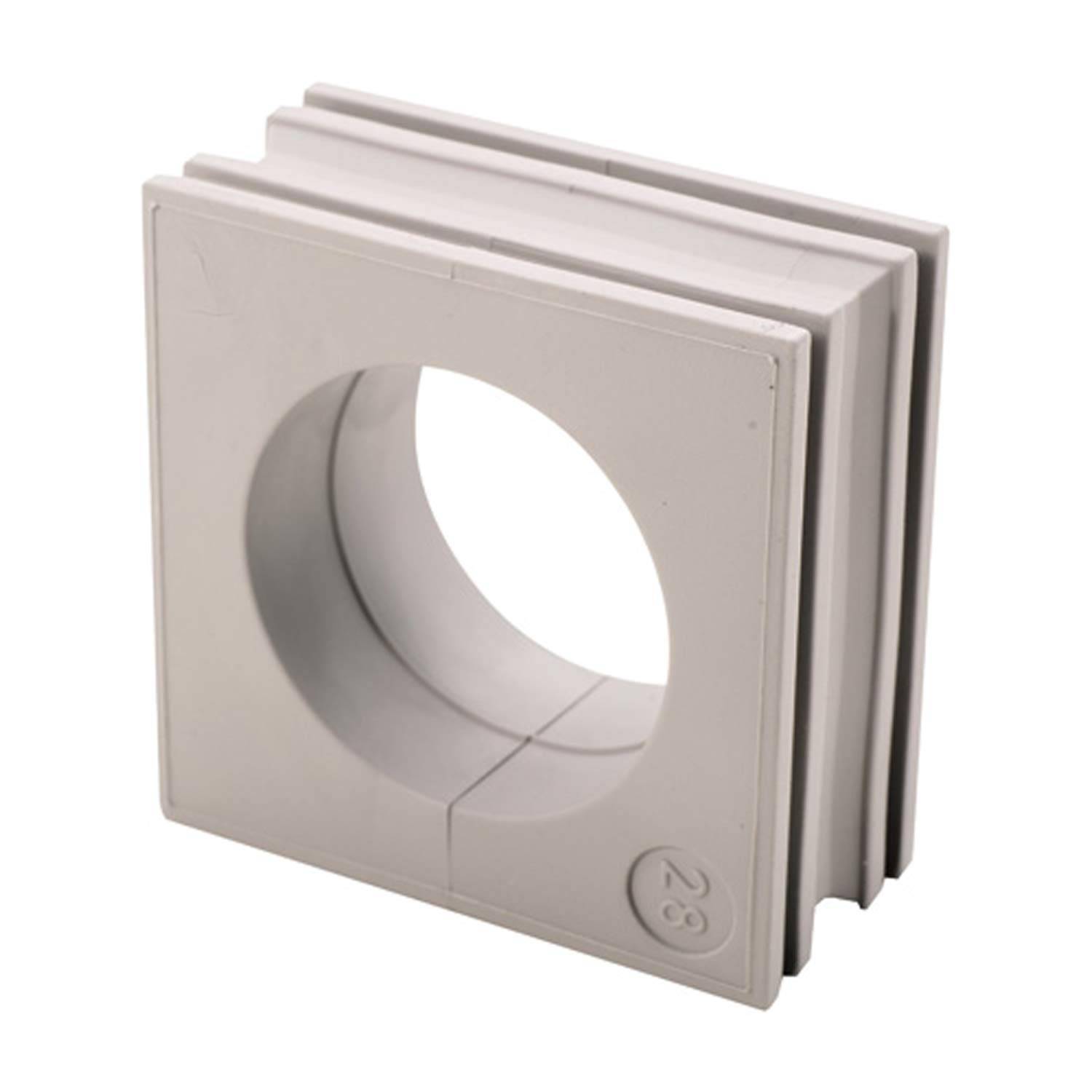 Ein grauer modularer Kabelmanagement-Block mit einer kreisförmigen Öffnung in der Mitte, der zum Organisieren und Schutz von Kabeln in elektronischen Aufbauten verwendet wird.