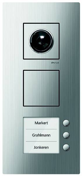 Gegensprechanlage mit einer runden Kamera, einem quadratischen Bereich, der wahrscheinlich für ein Display vorgesehen ist, und einem Knopf mit der Beschriftung 'Markert'.