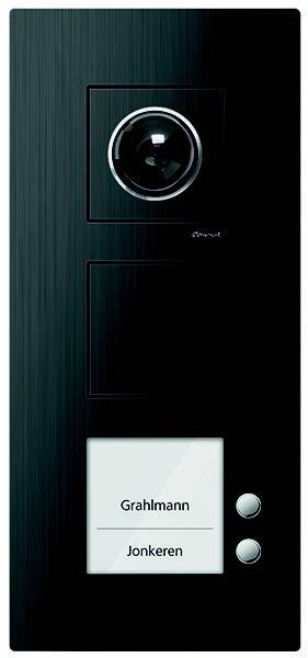 Ein schwarzes vertikales Panel mit einem runden Wahlschalter und einem rechteckigen Knopf darunter, das ein schlankes und modernes Design aufweist.