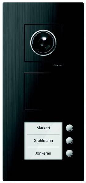 Ein schlankes schwarzes Gegensprechanlage-Panel mit einem kreisförmigen Lautsprecher, einem rechteckigen Knopf und einem Namensschild mit der Aufschrift 'Markert' am unteren Rand.