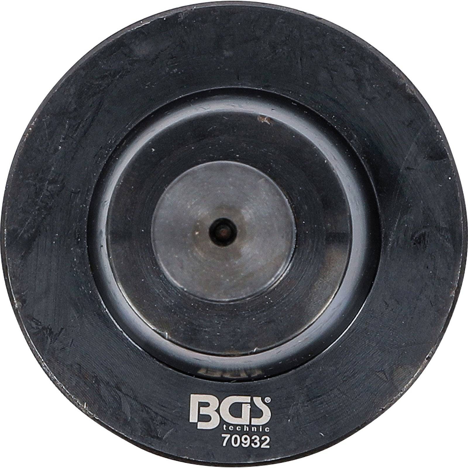 Schwarzer kreisförmiger Artikel mit der Beschriftung 'BGS technic 70932', wahrscheinlich ein Werkzeug oder eine Komponente, von oben betrachtet.