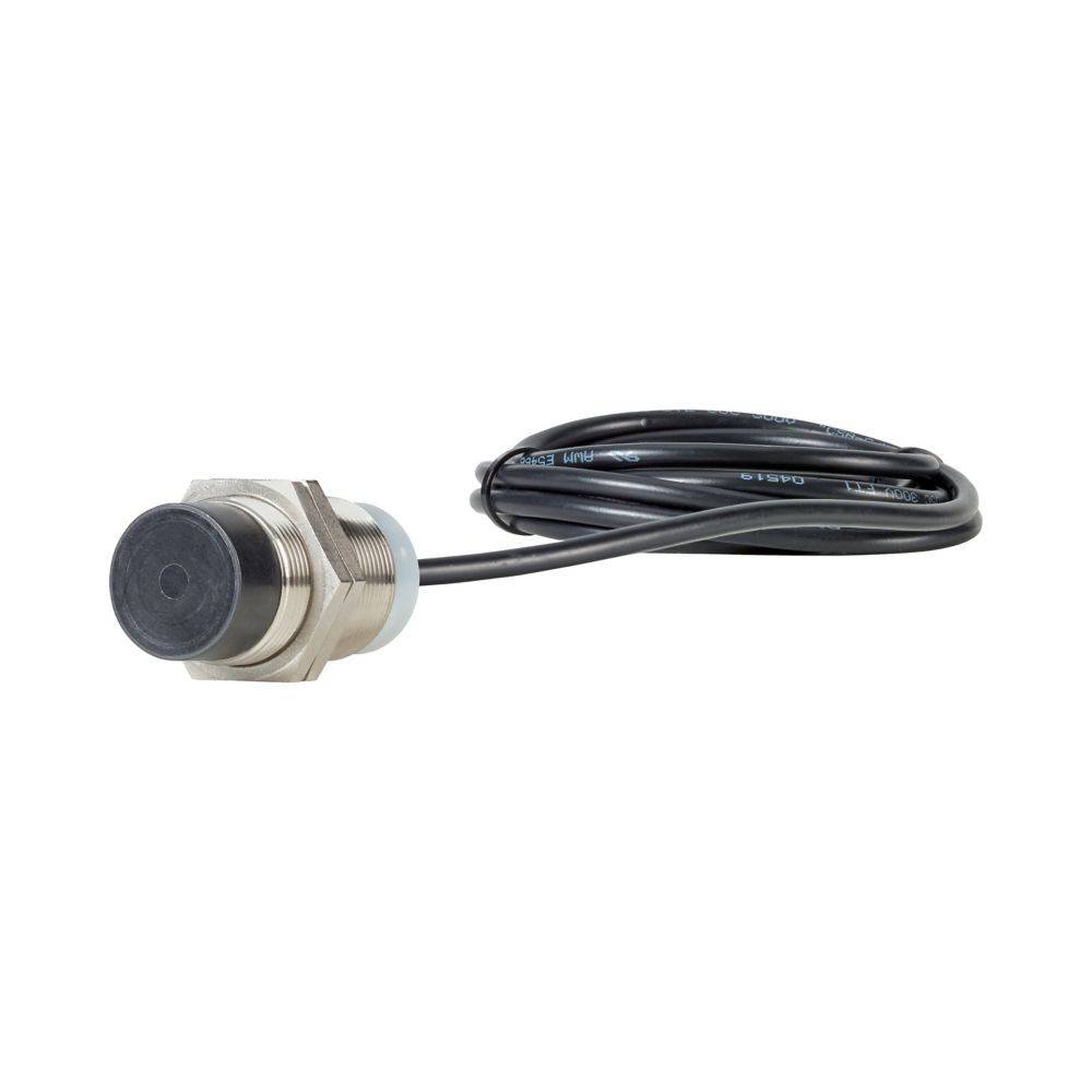 Ein Näherungssensor mit einem zylindrischen Metallgehäuse und einer schwarzen Sensoroberfläche, angeschlossen an ein langes schwarzes Kabel, der zur Erkennung von nahe gelegenen Objekten verwendet wird.