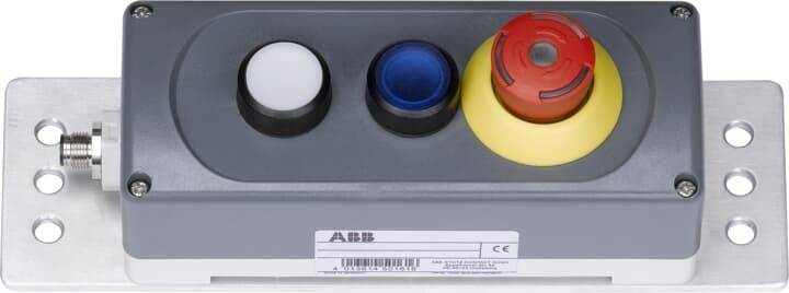 Drei kreisförmige Tasten: weiß, blau und rot auf einer gelben Grundfläche, auf einem grauen Panel. Das Panel trägt das 'ABB' Logo und ein Barcode-Etikett.