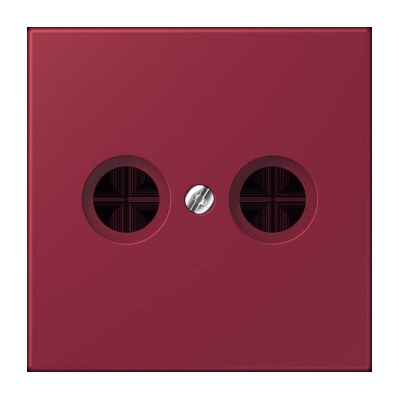 Eine rote quadratische Platte mit zwei kreisförmigen Auslässen und einer zentrierten Schraube, möglicherweise eine Abdeckplatte für elektrische oder Audio-Anschlüsse.
