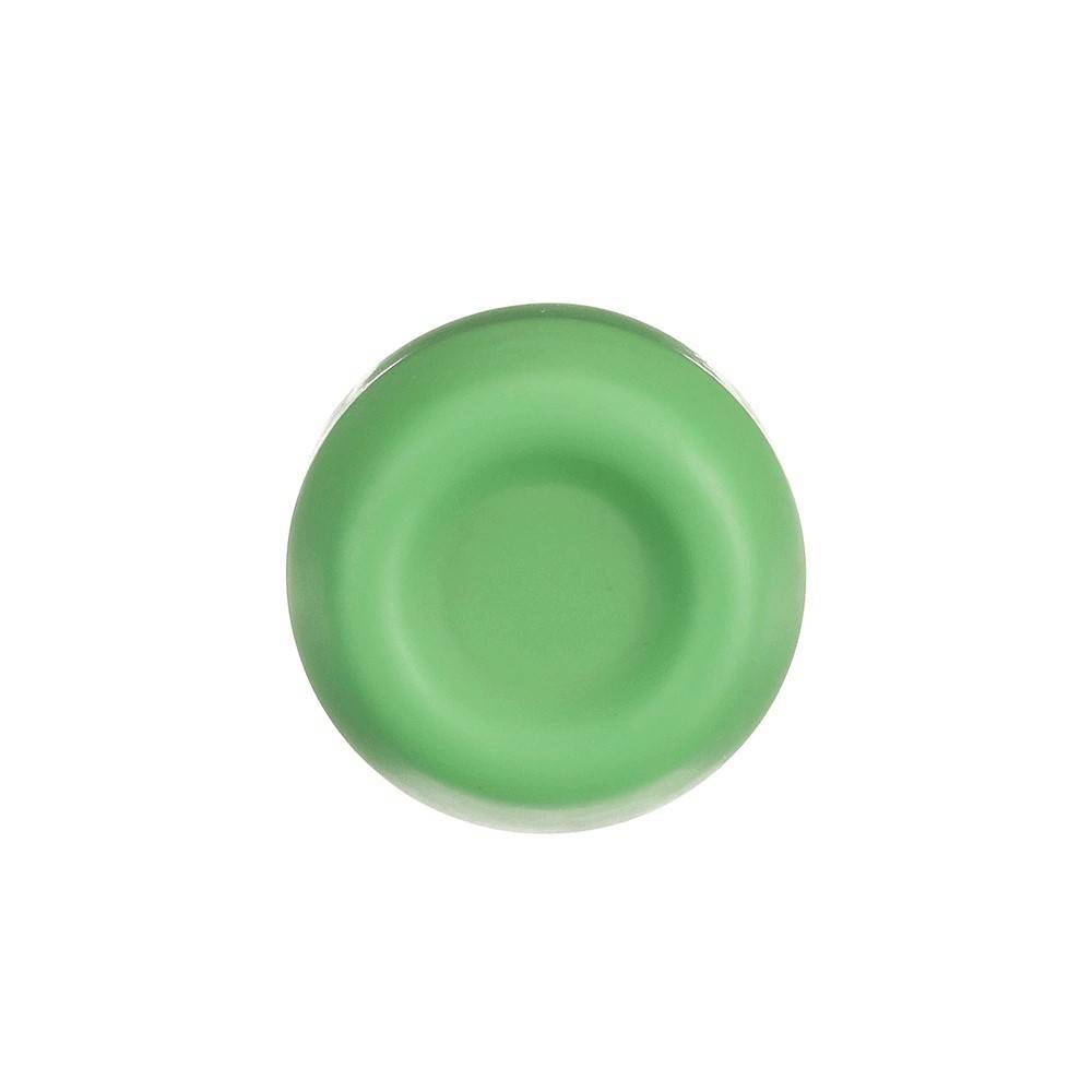 Ein grüner Plastikflaschendeckel, von oben betrachtet.