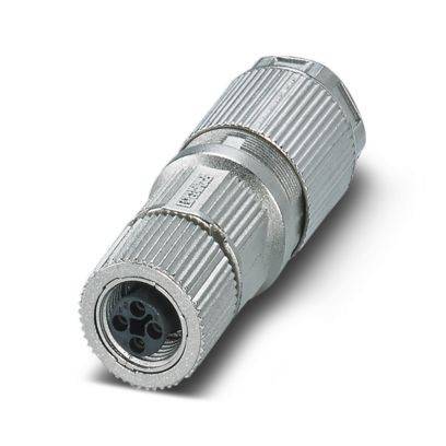Ein zylindrischer Metallstecker mit einer gerippten Oberfläche und mehreren Stiften wird auf einer weißen Oberfläche platziert.