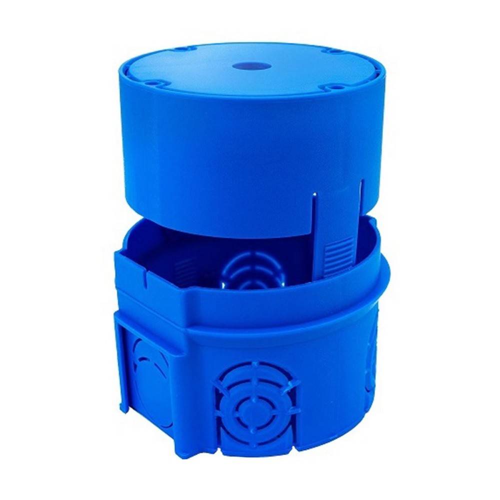 Eine blaue modulare Kunststoffkomponente mit einem zylindrischen Oberteil und einer quadratischen Basis. Sie weist schlitzartige Öffnungen an den Seiten auf.