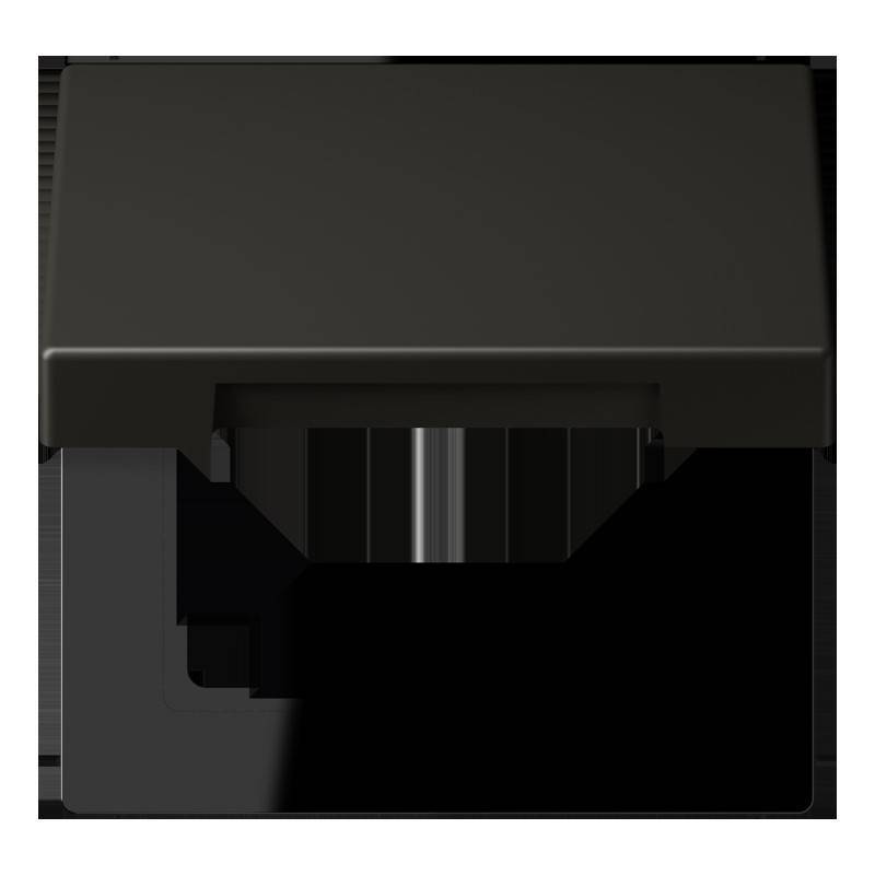 Eine schwarze Metallbox mit rechteckiger Form und einem vorstehenden unteren Abschnitt, von oben gegen einen einfarbigen Hintergrund betrachtet.